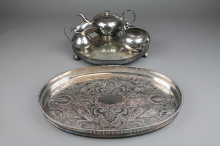 A silver plated hammered pattern 3 piece tea set, 2 silver plated trays