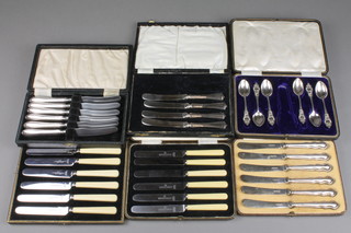 A set of 6 silver handled butter knives and 5 other cased sets
