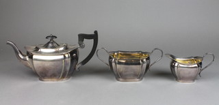 A silver plated 3 piece octagonal tea set with ebony mounts