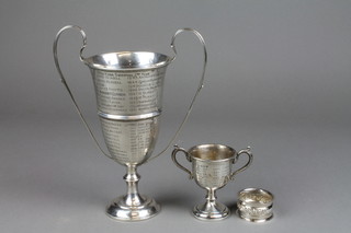 A silver 2 handled trophy cup, Birmingham 1912 9 1/2", a small ditto and a napkin ring, approx. 426 grams