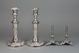 A pair of Edwardian silver plated epergne stands, a pair of ditto candlesticks