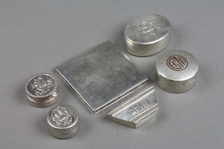 An oval silver pill box with chased armorial and 5 other boxes