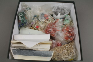 A collection of coral and other bead necklaces