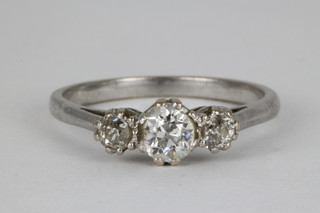 An 18ct white gold 3 stone diamond ring, the centre stone approx. 0.5ct flanked by 2 single stones, each approx. 1/8th ct
