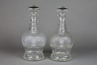 A pair of Georgian design cut glass mallet shaped decanters and stoppers with 3 ring necks 11" 