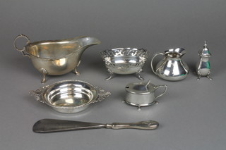 A silver sauce boat with cut rim and shell knees on pad feet, Birmingham 1940 and 7 other items