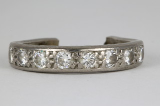 An 18ct white gold half eternity ring set with 8 brilliant cut diamonds, approx. 0.5ct, the mount cut