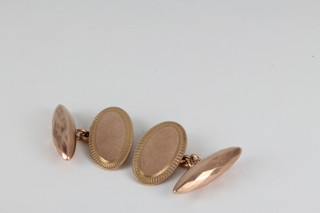A pair of bright cut 9ct gold cufflinks, approx. 5.8 grams