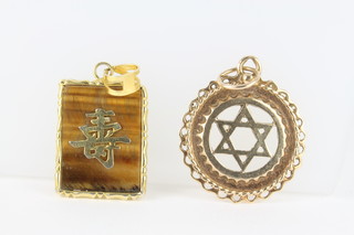 A 9ct gold Star of David pendant, a tigers eye ditto