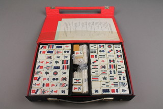 A cased bone and bamboo mahjong set