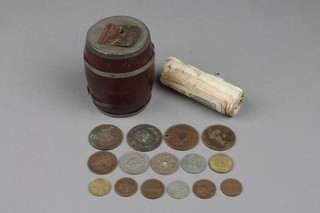 A barrel shaped metal bound money bank 3" and minor bank notes and coins