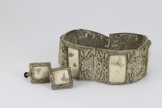 A Persian white metal filigree 4 plaque bracelet and ear clips
