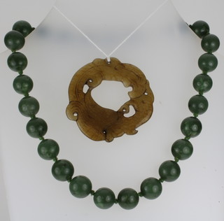 A string of jadeite beads 15", together with a small jadeite disc 