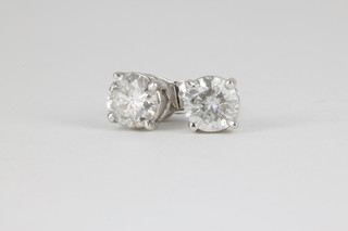 A pair of 14ct white gold single stone diamond ear studs, each approx. .4ct 
