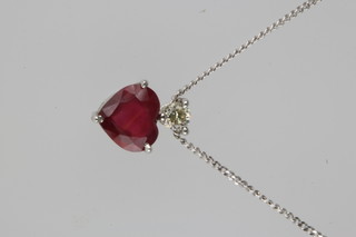 An 18ct white gold heart cut ruby and diamond pendant, the ruby approx. 1.5ct