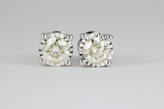 A pair of 18ct white gold single stone diamond ear studs with screw backs, approx. 1.42ct 