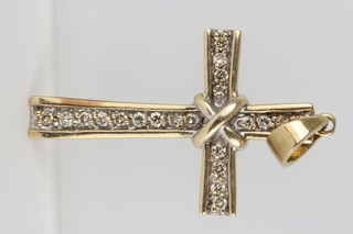 A gold diamond set cross