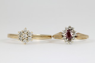 A 9ct gold 7 stone diamond cluster ring, a ruby and diamond ditto