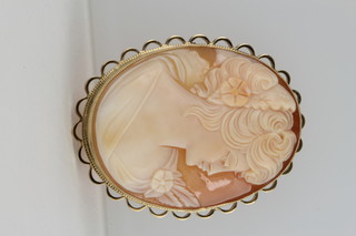 A portrait cameo brooch of a young lady in a 9ct gold mount