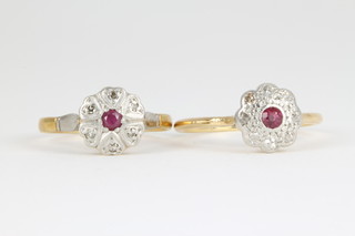An 18ct ruby and diamond cluster ring and 1 other