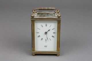 Dent of London, a 19th Century carriage clock with enamelled dial and Roman numerals contained in a gilt and glass case, the top section of glass loose
