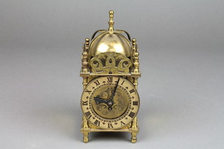 A Smiths electric lantern clock contained in a brass case 7" 