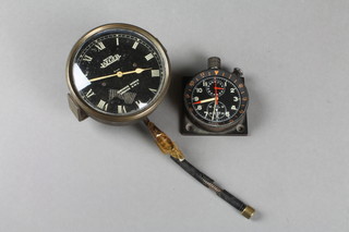 An Heuer Super Autavia aircraft clock 2", together with a Jaeger 8 day car clock