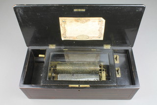 A cylinder musical box with hinged lid, playing 8 aires, label to interior marked Clockworks E Bourdelot, contained in an inlaid rosewood case 5"h x 16"w x 7"d