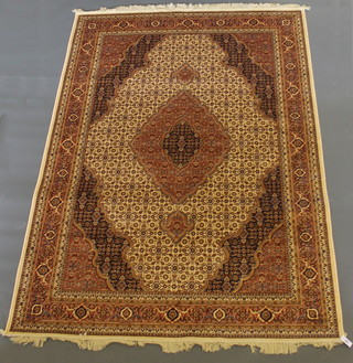 A gold ground Persian style Belgian cotton rug 107" x 79"