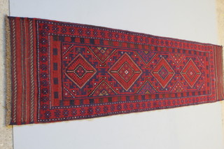 A Meshwani red and blue ground runner with 4 diamonds to the centre 100" x 24"