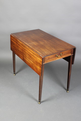 A Georgian mahogany Pembroke table fitted a drawer, raised on square tapering supports ending in brass caps and castors 28"h x 31 1/2"w 19"d, when fully extended and opened 38 1/2"