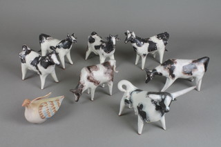 A collection of Studio pottery figures of stylised cattle and 1 bird