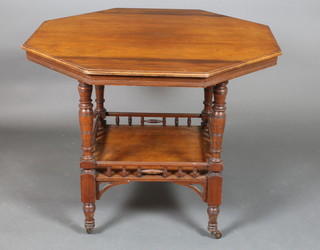 A Victorian octagonal walnut occasional table with undertier and bobbin turned decoration, raised on turned and block supports 29"h x 35 1/2"w x 25 1/2"d 