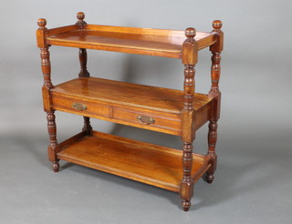 A Victorian walnut 3 tier buffet raised on turned and block supports, the base fitted 2 drawers 41"h x 41 1/2"w x 17"d