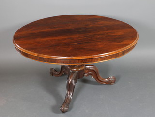 A Victorian circular snap top rosewood breakfast table, raised on a turned and tripod base 29"h x 48"diam