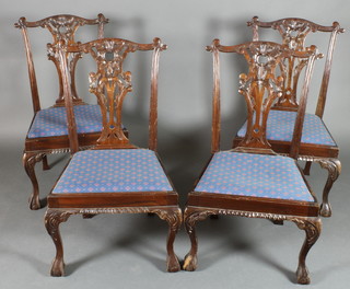 A set of 4 Chippendale style mahogany slat back dining chairs with upholstered drop in seats, raised on cabriole claw and ball supports (1 chair f and r)