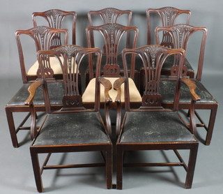 A set of 8 19th Century Hepplewhite style splat back dining chairs, 2 with arms, with upholstered drop in seats, raised on square legs with H framed stretcher