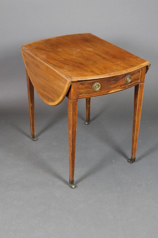 A Georgian oval inlaid mahogany Pembroke table with crossbanded top, fitted a drawer, raised on square tapering supports ending in brass caps and castors 27 1/2"h x 29"w x 20"d x 39 1/2" when open 