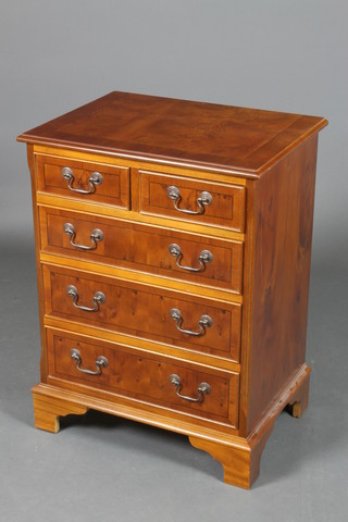 A Georgian style yew wood chest of drawers with the crossbanded top and canted corners, fitted 2 short and 3 long drawers with brass swan neck drop handles, raised on bracket feet 30 1/2"h x 23"w x 17"d 