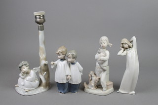 A Lladro table lamp in the form of a seated angel beneath a tree 11", 3 other figures (f)