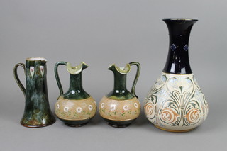 A Royal Doulton jug, the blue mottled ground with stylised flowers 7 1/2", a pair of ditto jugs with stylised flowers (f) and a baluster vase with waisted neck 12" 