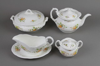A Coalport Wenlock Fruit tea and dinner service comprising teapot, milk jug, sugar bowl and lid, 6 tea cups, 6 saucers, 5 two handled bowls, 6 saucers, a tureen and cover, a tureen, a sauce boat and stand, 5 dinner plates, 6 dessert plates and 6 side plates 