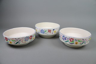 A 1960's Poole deep bowl with footed base 9" and 2 others