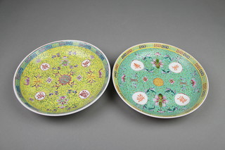 A pair of Chinese yellow and turquoise ground shallow bowls with formal scrolling flowers 9 1/2" 