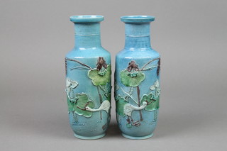 A pair of 19th Century Chinese turquoise glazed oviform vase with waisted necks decorated with Heaven amongst lilies 9" (1f)