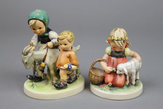 A Hummel group of a girl and boy with goat 334.1955 5", a ditto of a girl with ram  361.1960 4"