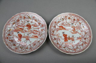 A pair of 18th Century Chinese ochre shallow bowls decorated with figures in a garden landscape enclosed by a band of formal flowers 9" (1f)