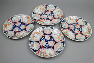 A set of 20th Century Japanese Imari plates decorated with panels of birds and flowers 10", a larger ditto