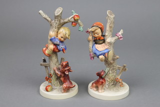 A pair of Hummel figures of a boy and girl hiding in a tree with a dog beneath 56B and 56A 5" 