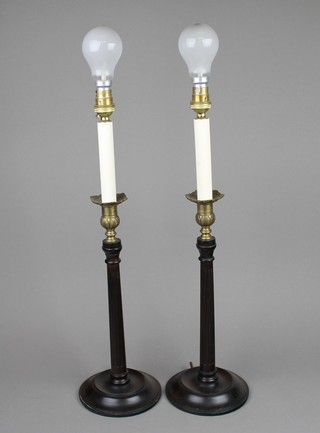 A pair of turned and fluted mahogany table lamps with gilt metal sconces 14" 
